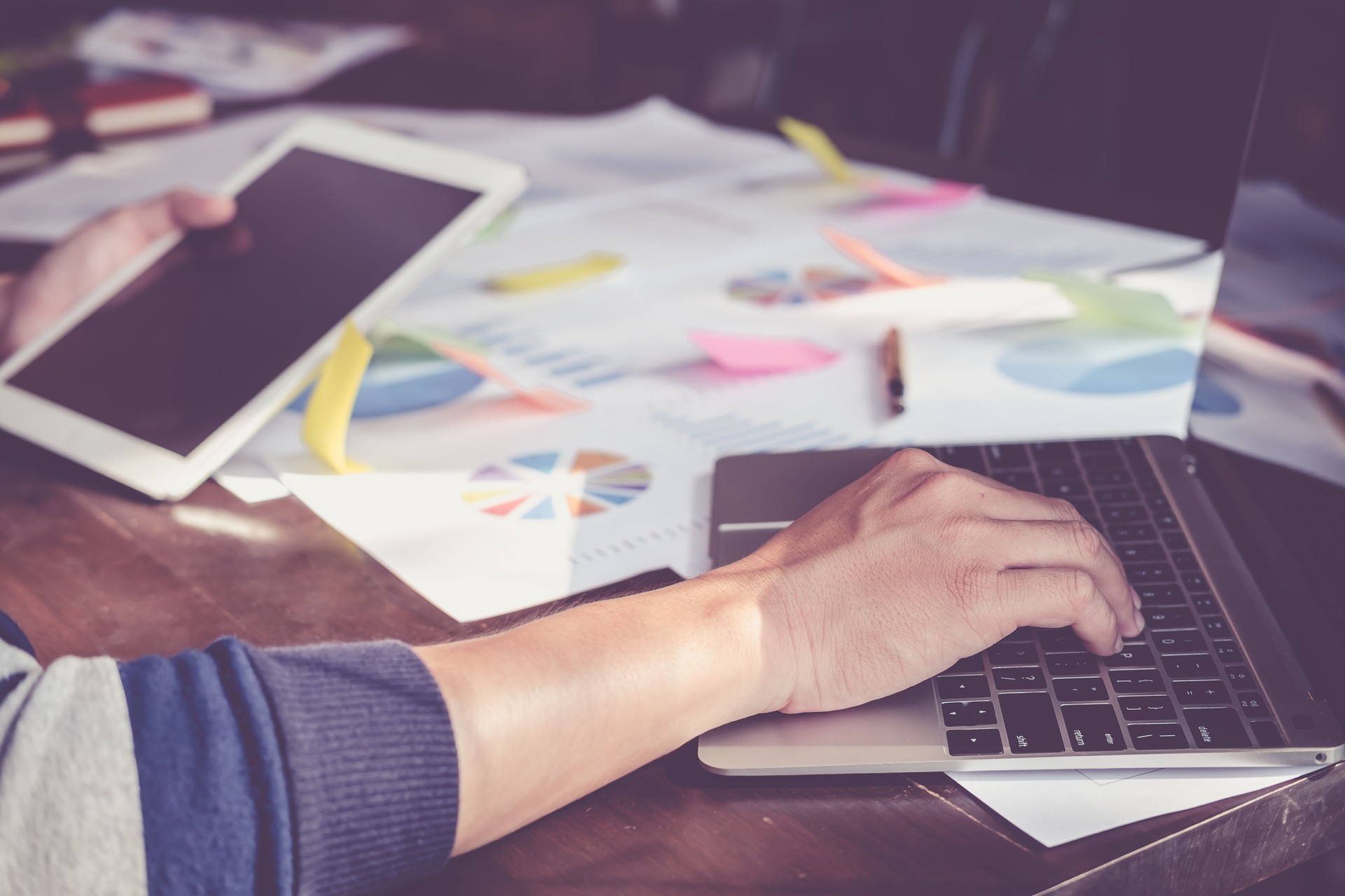 Asian business people meeting with new startup project pointing graph discussion and analysis data charts and graphs.Business finances and accounting concept